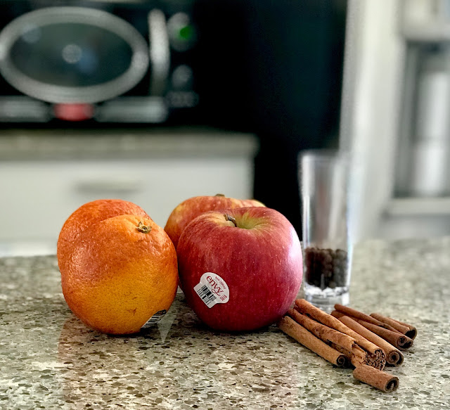 cinnamon sticks, allspice, apples, oranges