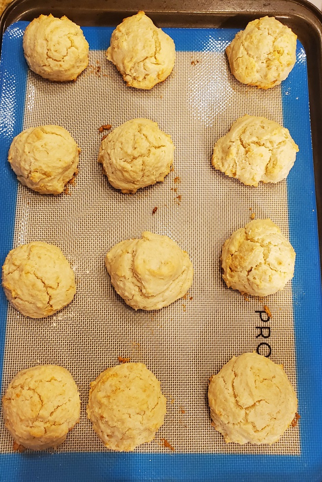 heavy cream biscuits cooling on a silicone mat
