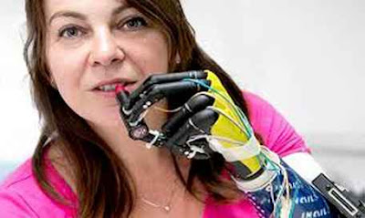 A woman are trying to give lipstic through her bionic arm