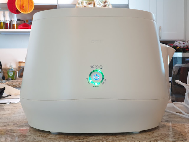 A white Lomi sitting on a countertop.