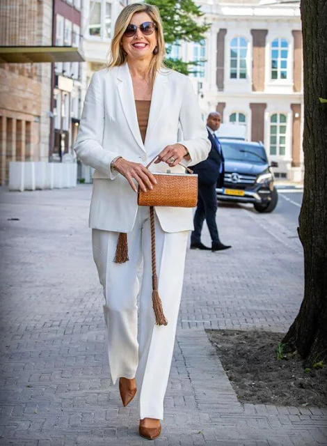 Queen Maxima wore a new white plain blazer suit from Massimo Dutti, and brown silk blouse