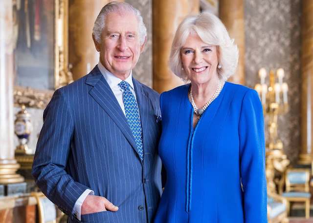 Prince George of Wales. named Queen Camilla at King Charles III’s coronation. Queen Camilla wore a blue midi dress. Pearls necklace