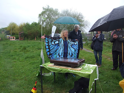 Caroline Lancelyn Green in her butterfly scarf, unveiling the new information board.
