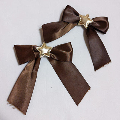 Brown and gold star bows