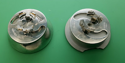 The Pioneer movement has an alloy base, but the Swiss Bradux holder has a plastic base