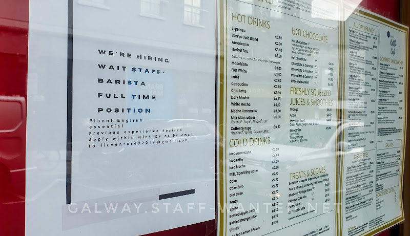 Staff-wanted advertisement, and hot and cold drink meus in the window of Galway's Kettle cafe.
