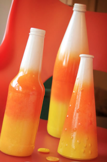 make these candy corn decorations from bottles or vases