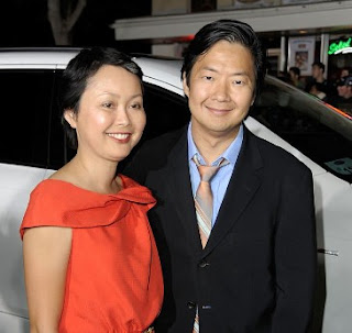 Tran Jeong with her husband Ken while the car in the background