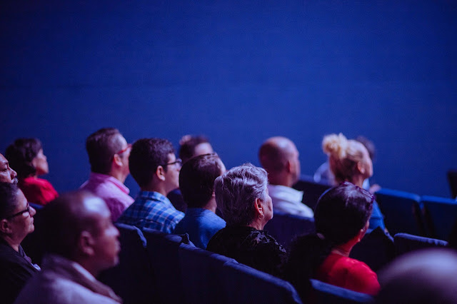 people watching movie in cinema