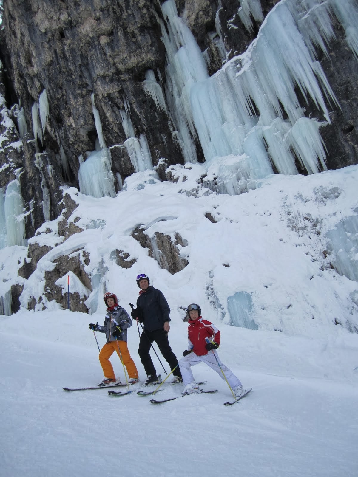 The boys and l at the base of a frozen waterfall