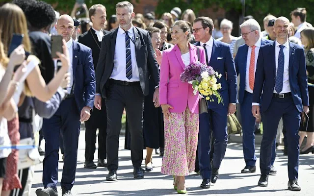 Crown Princess Victoria wore a tailored buttoned fuchsia blazer by Zara, and a pink plisse pleated midi skirt by & Other Stories