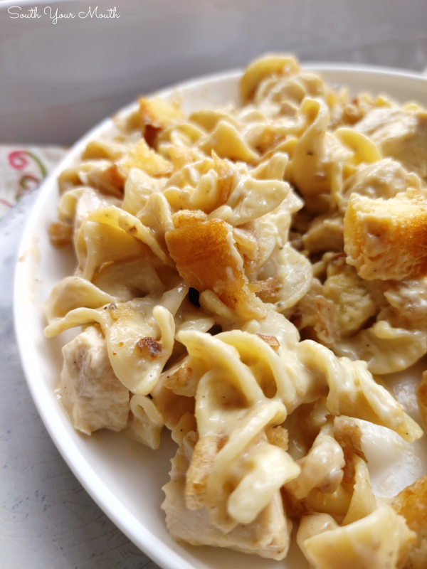 French Onion Chicken Casserole! An easy, creamy chicken noodle casserole with French onion soup, topped with toasty buttered bread cubes and crispy fried onions.