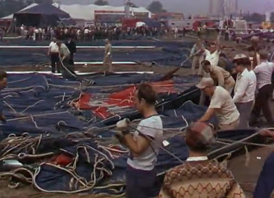 Workers stretch out the canvas of the Big Top before raising it at their latest location.