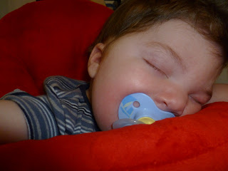 baby Mason asleep in his jumper