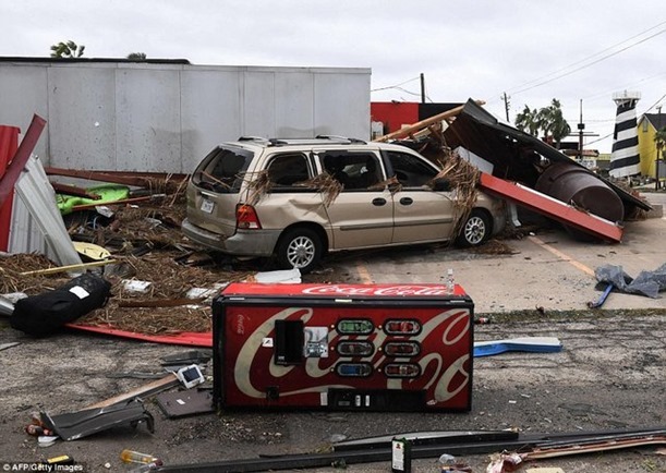 439DFF8100000578-4827474-A_knocked_over_soda_machine_lies_in_front_of_a_damaged_car_and_r-a-3_1503871562671