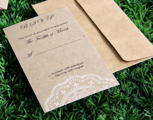 rsvp card made of recycled kraft paper with doily stamp in white ink