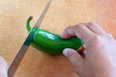 Slice off top of chili pepper