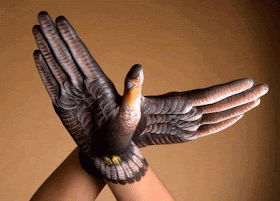 trompe l'oeil eagle painted on splayed hands