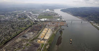 This May 12, 2005, file photo, shows the port of Longview on the Columbia River at Longview, Wash. The Department of Ecology said Tuesday, Sept. 26, 2017, it rejected a water quality permit that Millennium Bulk Terminals wanted because the proposed facility near Longview in southwest Washington state would have caused "significant and unavoidable harm" to the environment. (Photo Credit: Elaine Thompson, AP) Click to Enlarge.