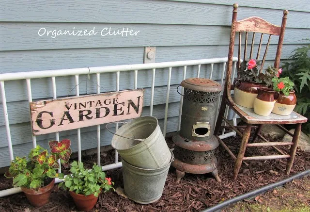 Photo of a junk garden vignette.