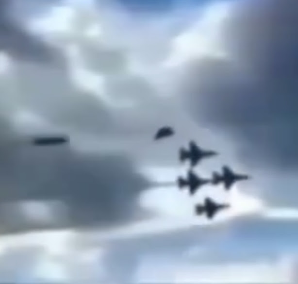 2 UFOs where seen flying behind 4 air display jet's at air show in the USA.