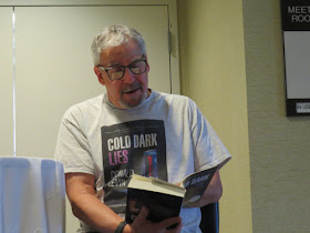 author Don Levin reading a book