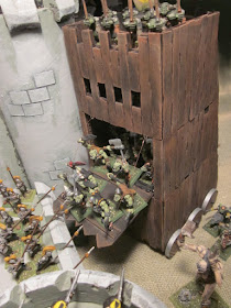 Orcs attacking castle with Warhammer Siege Tower