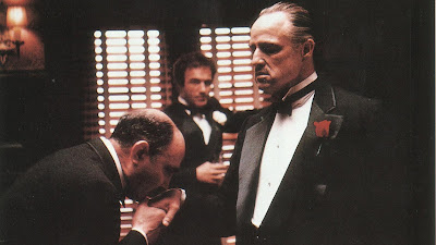 Marlon Brando as Don Vito Corleone, Bonasera kisses Don Vito Corleone's hand, accepts him as his Godfather, James Caan as Sonny Corleone, Directed by Francis Ford Coppola