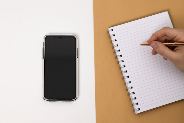 Image of a Smartphone and a notebook