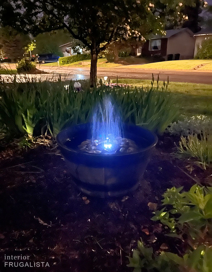 A handmade light up rechargeable solar fountain to add curb appeal to your flower beds at night.