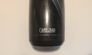 The lower part of the bottle stating the features it has