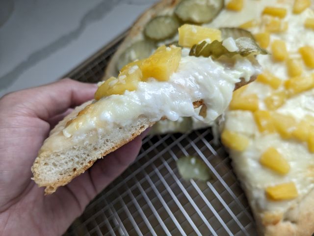 DiGiorno Pineapple Pickle Pizza cross-section.