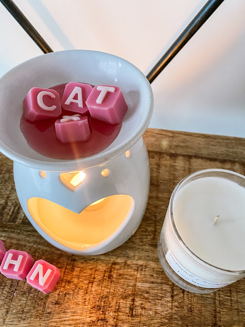 Pink personalised wax melts melting in a wax melter