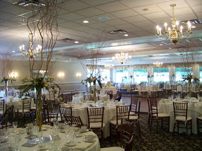 Pilsner vases with curly willow branches bear grass