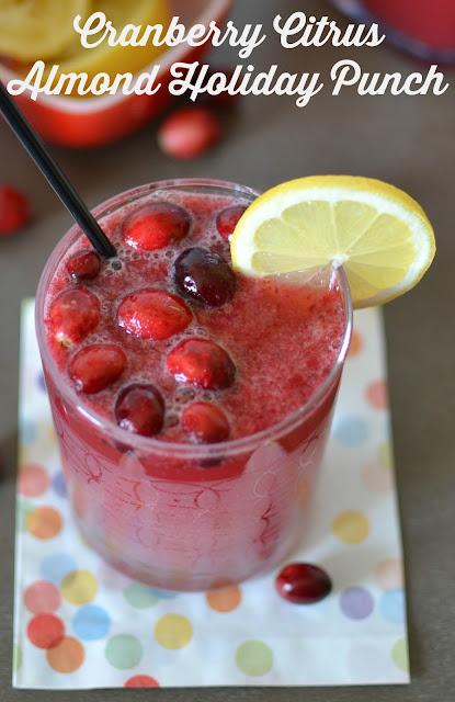 Cranberry Citrus Almond Holiday Punch Recipe from Hot Eats and Cool Reads! This non-alcoholic drink is tasty, family friendly and festive! Great for any holiday including Christmas, New Year's, Thanksgiving or even game day! Add your favorite vodka for a delicious adult beverage!