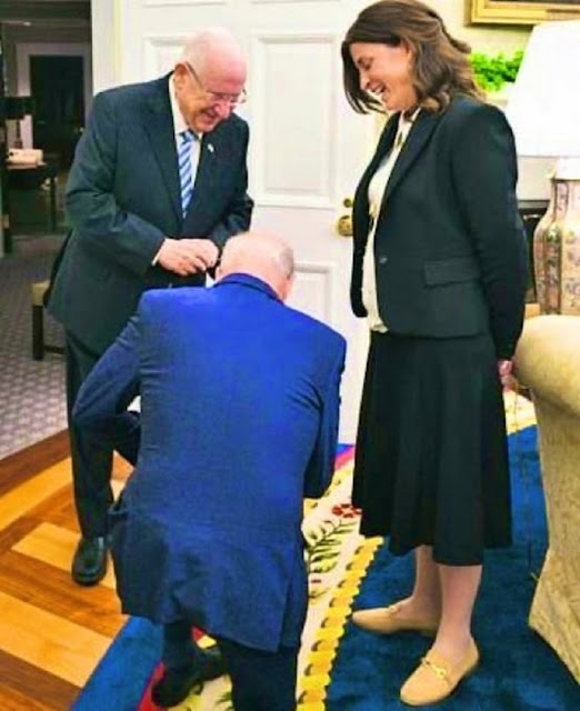 A picture of Biden kneeling in front of a prominent Israeli official causes an uproar