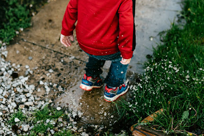 Child splash puddle france