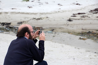 CJC taking a picture on the beach