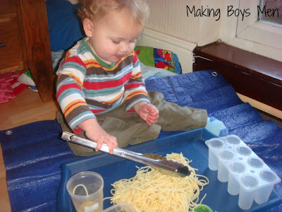 Baby play with spaghetti