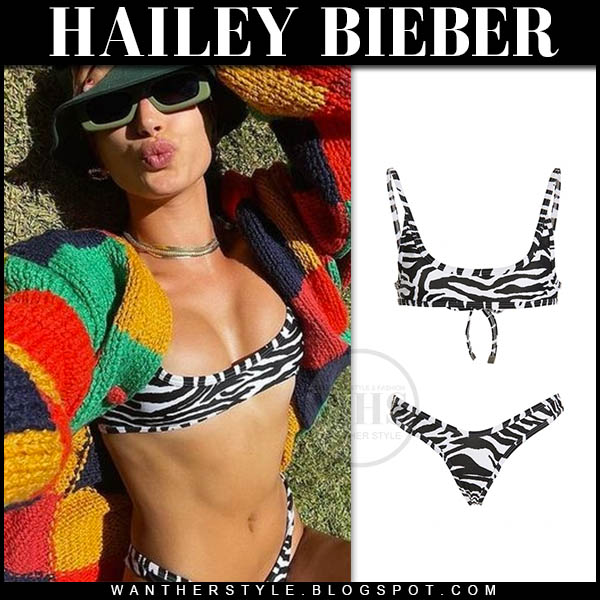 Hailey Bieber in zebra print bikini and green sunglasses
