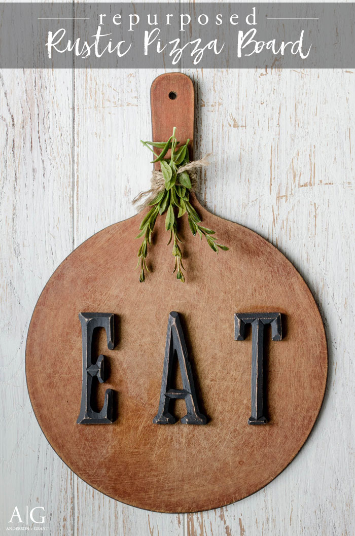 A beat up pizza board is repurposed into a piece of decor for a rustic kitchen.  ||  www.andersonandgrant.com