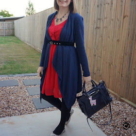 awayfromblue Instagram | navy waterfall belted cardigan over berry ruffle dress with rebecca minkoff regan bag and printed flats