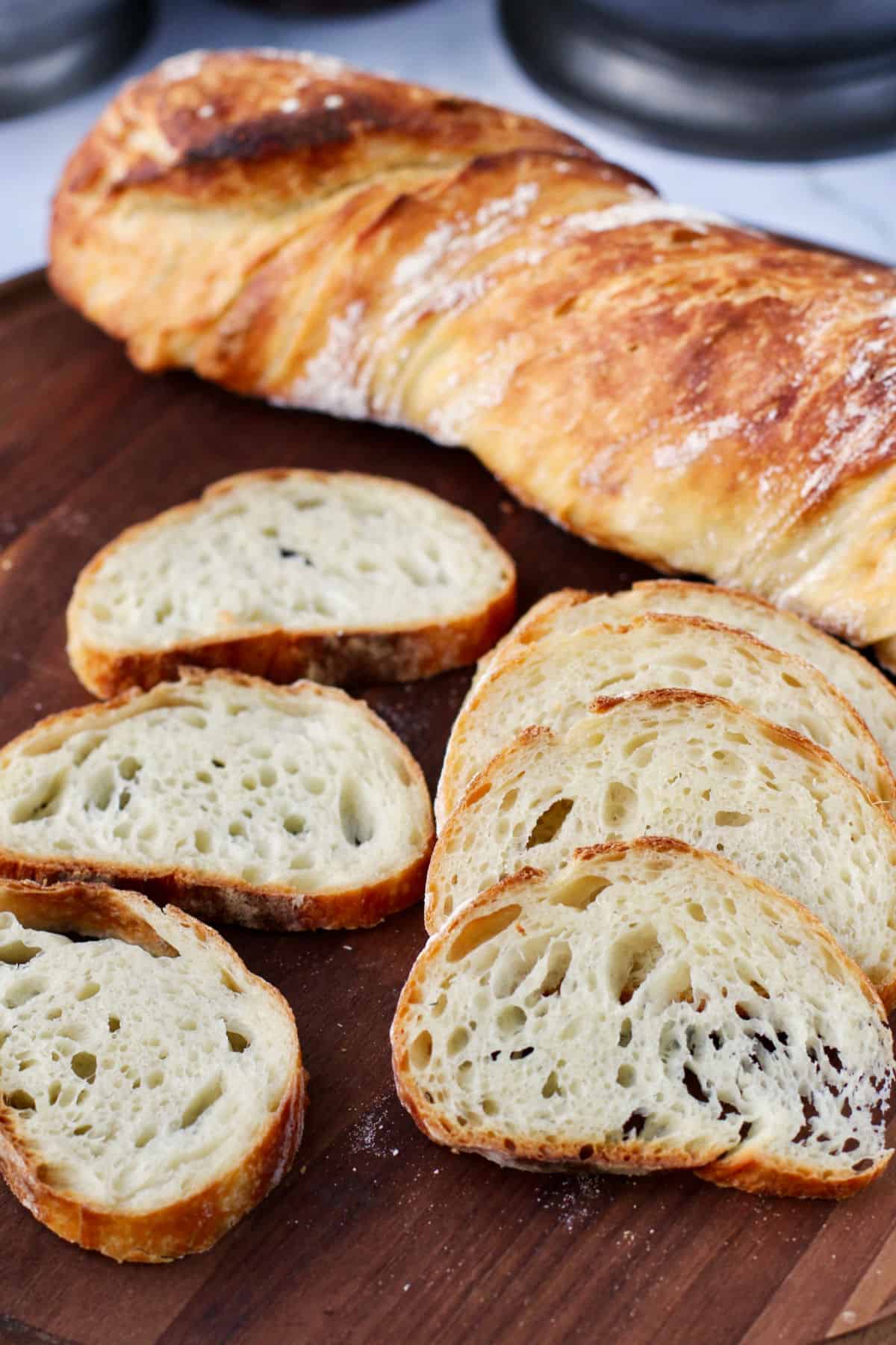 No Knead Durum Stirato slices on cutting board.