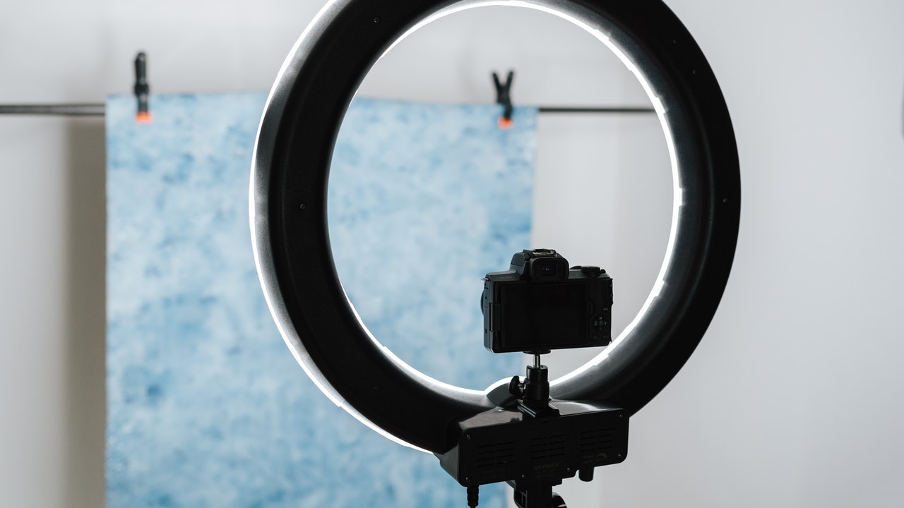 camera on tripod aiming at painting | 9 Professional Product Photography Tips