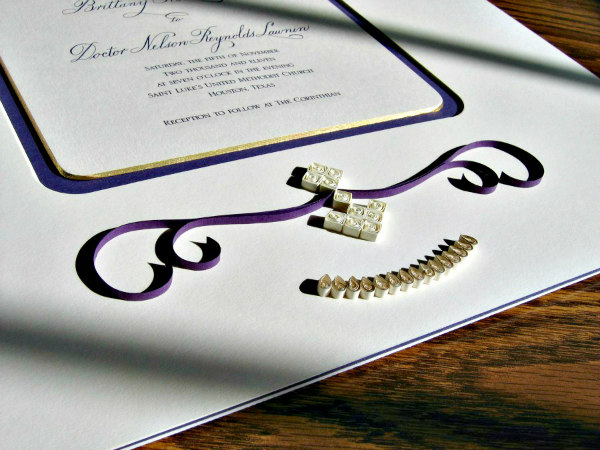 detail of quilled wedding invitation mat with rounded corner cut out