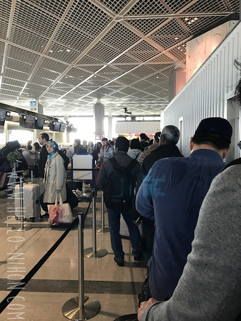 Waiting line at the airport for Asiana Air