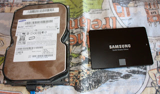 Photo of old and new hard drive... same storage size but old one is two or three times bigger.