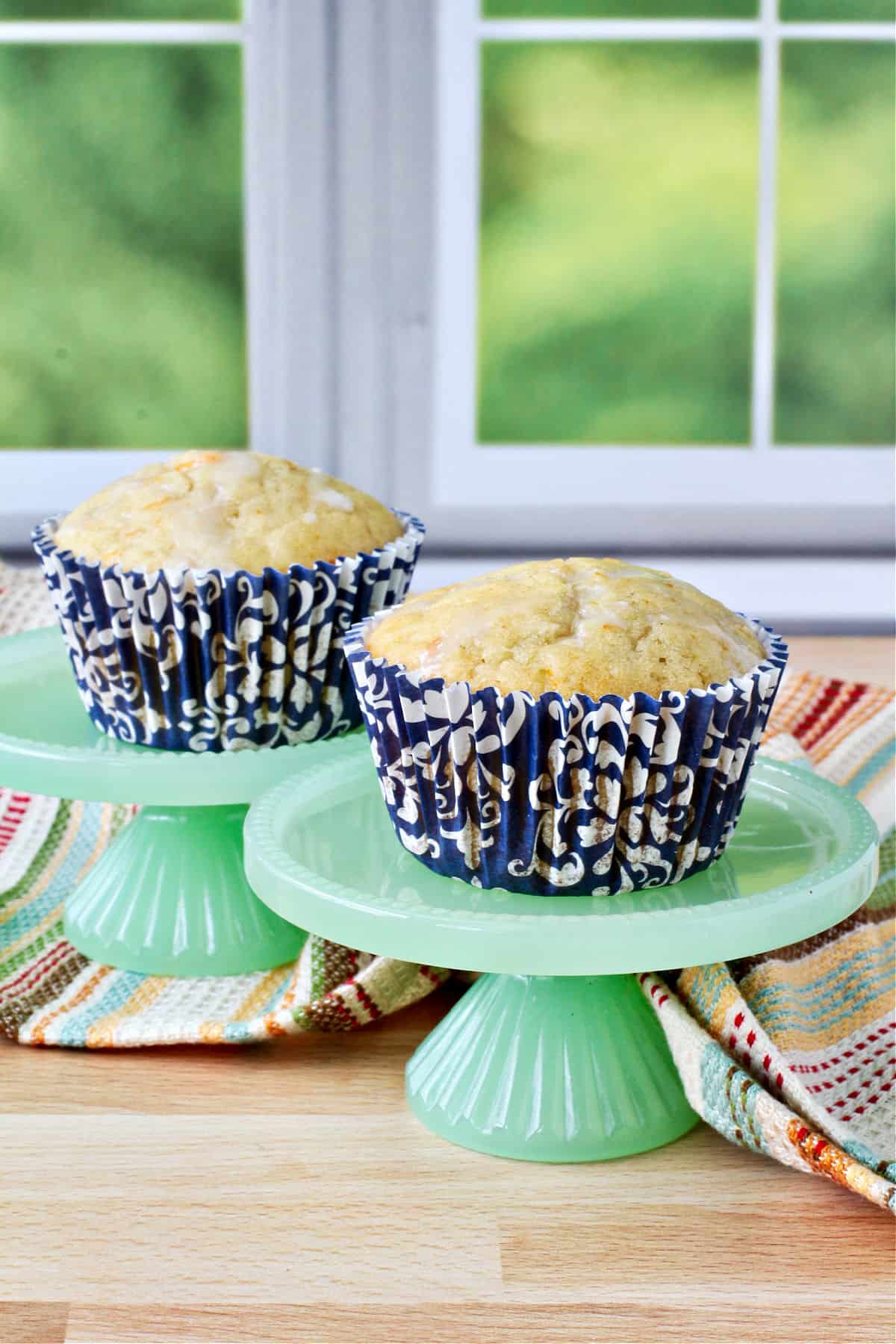 Sourdough Tangerine Muffins on green mini cake stands.