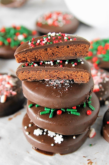 Christmas Homemade Thin Mints image ~ Who says you can't have Thin Mints for the holiday season?  You sure can with these copycat Christmas Homemade Thin Mints!  Crushed candy canes and sprinkles make this holiday version of the Girl Scout classic extra fun and festive.