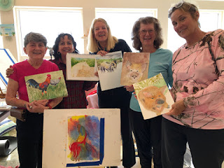 5 women and 6 watercolor paintings from the art session.